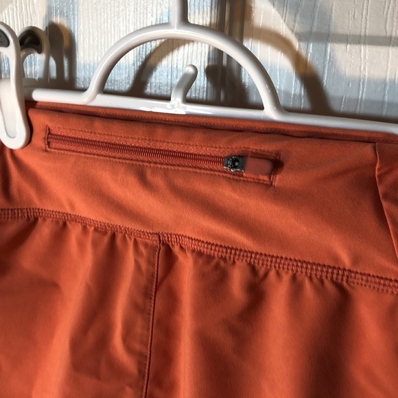 M Under Armour light orange running shorts​​​​​ - Picture 6 of 11